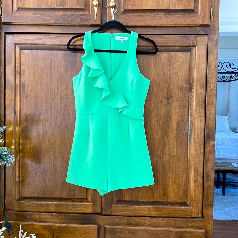 Likely green asymmetrical ruffle lined romper S